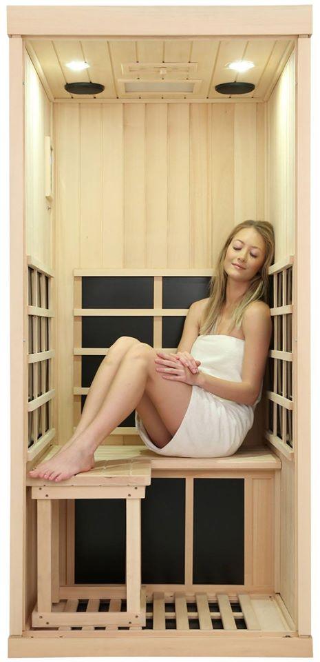 Evolve 10 1 person sauna with lady sitting inside with knees up